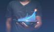 © krungchingpixs - Business planning and strategy to growth. Business data analysis and project management concept, Man holding smartphone with analyze financial graph for investment, Corporate future growth plan.