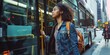 © Brian - Young woman boarding the bus for public transportation on her commute