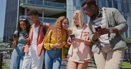 Wall Mural - Friends, students and phone for texting at college, mobile app and share with post, meme or web blog. Gen z group, man and woman with smartphone, social media and funny chat at university in Atlanta