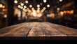 Dark wooden table with no one at it in front of restaurant background with an abstract bokeh effect. might be employed to montage or display your merchandise