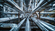 A maze of interconnected stainless steel pipes in an industrial warehouse showcasing complex engineering