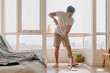 Asian Thai man using mop for cleaning floor in living room apartment, Man do household chores, housework concept. marriage life.