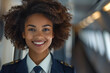 Afro woman wearing airline cabin crew uniform in commercial airplane