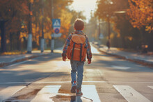  boy with backpack walking over pedestrian crossing