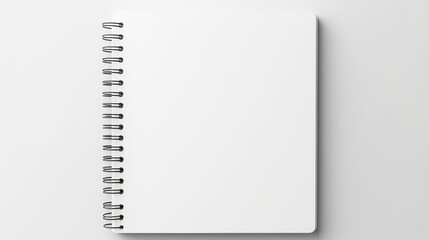 An empty white ruled notebook with a ring binder, observed from above, stands alone against a white backdrop.