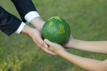 Wall Mural - Businessman hand giving Earth globe to little boy as Earth day concept as corporate social responsible to contribute greener environmental protection for sustainable future generation. Gyre