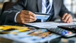 © Ali - businessman or an accountant calculating the credit card expenses, financial audit concept, businessman working in office