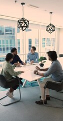 Canvas Print - Serious team of professionals, four multiethnic businesspeople negotiating in conference room, discuss project, consider contract terms and conditions, offer solutions, solve current business issues