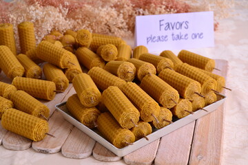 Wall Mural - Rustic fall wedding decoration beeswax candles favors handmade guest gifts, original party souvenirs yellow natural color