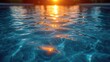  the sun is setting over the water of a swimming pool with ripples on the water and the sun reflecting off of the water's surface and reflecting off of the water.