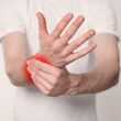 © New Africa - Man suffering from rheumatism on light background, closeup