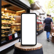 copy space device mockup on wooden surface against defocused shops on the street,business and e-commerce concept image