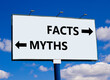 Facts or myths symbol. Concept word Myths and Facts on beautiful billboard with two arrows. Beautiful blue sky with clouds background. Business and facts or myths fact myth concept. Copy space.