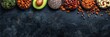Assorted healthy fats with avocado, nuts, seeds, and olive oil on wood background, space for text.