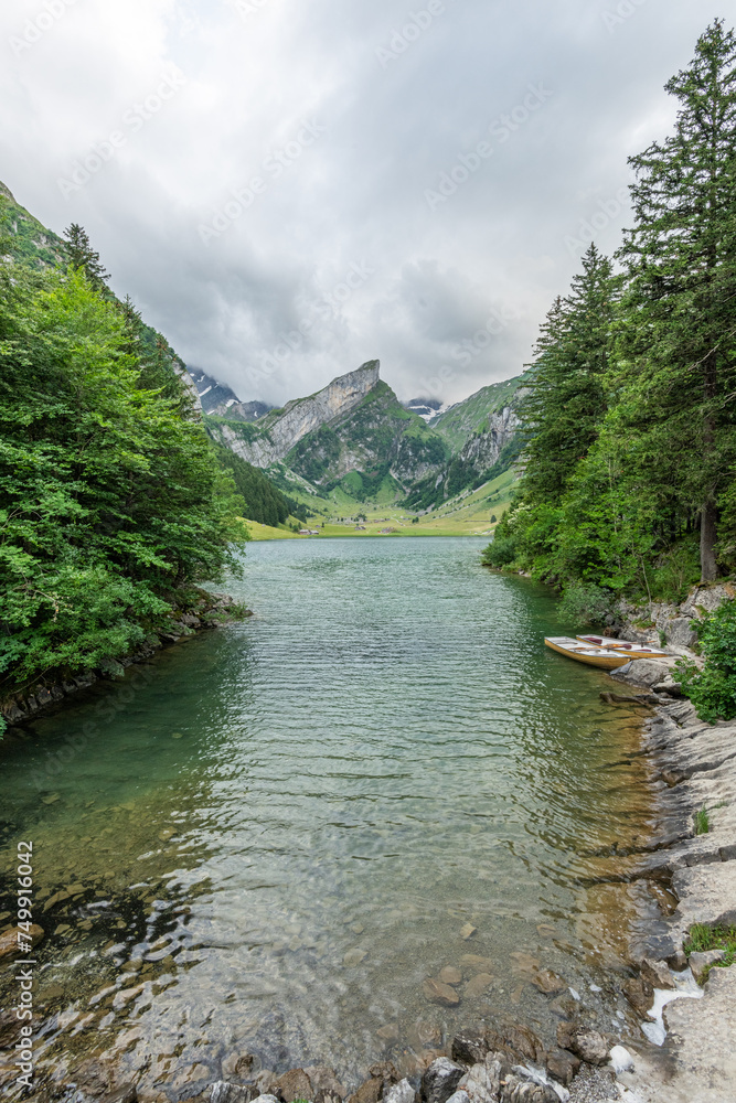 Beautiful summer view on lake Seealpsee in the Swiss alps, 2 rowing ...