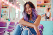 Portrait of happy fashionable Asian woman with hair dyed purple sitting in a bright beauty salon