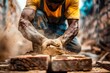Skilled worker carefully placing a brick while dust particles float around, highlighting craftsmanship
