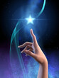 Elegant female hand touching a star