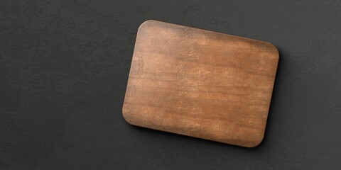 Wall Mural - Old rustic empty wooden cutting or chopping board on black stone background flat lay top view from above