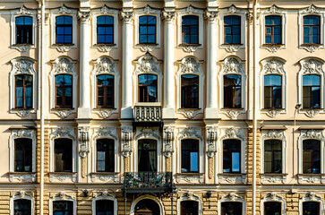 A fragment of the wall of an ancient building with balconies.