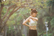 © Jirawatfoto - Shoulder pain problem. woman jogger. 30s asian female wearing white sportswear holding her shoulder with pain after running exercise in public park.