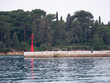 Deserted pier in the port. Small ripples on the surface of the sea. Rovinj, Croatia - February 29, 2024