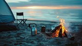 Fototapeta Tęcza - Coffee pot on camping fire, tent, folding chair table. Morning mist view on the beach background of campfire