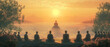 Serene Sunrise Meditation with Buddha Statue and Silhouetted Figures