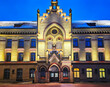 Renovated facade of Riga 1st Hospital at winter snowy day at evening illumination. 1st Hospital is the oldest civilian hospital in Latvia, it was founded 1803, Latvia