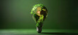 A conceptual image of a light bulb with the continents of Earth as its surface, glowing on a dark green background.