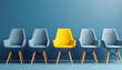 © BNNC TV - A yellow chair standing out from the crowd of chairs against a blue studio background.