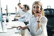 © opolja - Female customer support operator with headset and smiling.