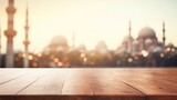 Fototapeta Londyn - A wooden floorboard contrasts against a blurred mosque backdrop, offering a serene setting for Ramadan festivities.