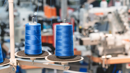 Aufkleber - Spools of color threads closeup, spinning machine