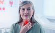 © New Africa - Endocrine system. Woman doing thyroid self examination indoors, banner design