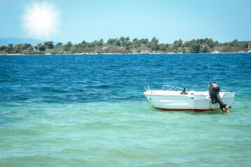 Wall Mural - A beautiful boat floating on the background of the sea silhouette