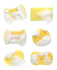Wall Mural - Different yellow sponges with foam isolated on white, top view
