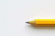 A yellow sharpened pencil on a white background.