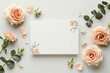 blank invitation mock up template with floral elements with peach roses and eucalyptus branches, modern and fresh on light background, top view.