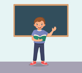 Wall Mural - Cute little boy holding book standing in front of class reading speaking