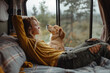 woman rests with her dog in campervan