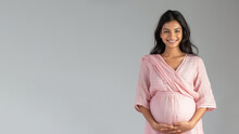 Indian Pregnant Woman With Pregnancy Belly, In Soft Pink Clothes