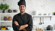 The sincere smile of a male chef, who exudes culinary passion while standing boldly in his fine black suit