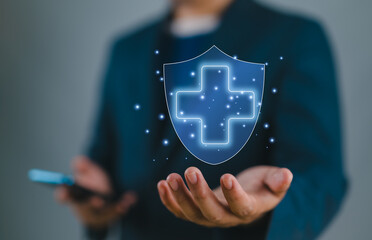 Aufkleber - Businessman holding virtual protect health and insurance sign with copy space.