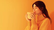 © praewpailyn - A digital illustration of a young woman enjoying the cozy embrace of a warm drink, surrounded by a soothing orange ambiance