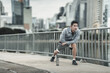 © Charnchai saeheng - A man stretching his muscle  in the city center park before  cardio workout, running.  Health and Lifestyle in big city life concept.