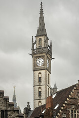 Wall Mural - Gent in Belgium. Clock tower in the city center.