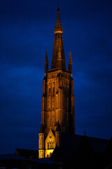 Wall Mural - Bruges in Belgium. Church tower at night.