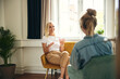 © Flamingo Images - Smiling psychologist talking with a client in pleasant surroundings