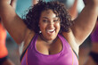 joyful portrait of an overweight african american woman in the gym